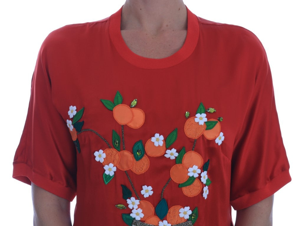 Red silk floral blouse with orange and crystal embellishments by Dolce & Gabbana, featuring a elegant, fitted design.