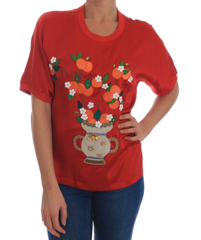 Red silk floral blouse with orange and crystal embellishments from Dolce & Gabbana, featuring a stylish, elegant design.
