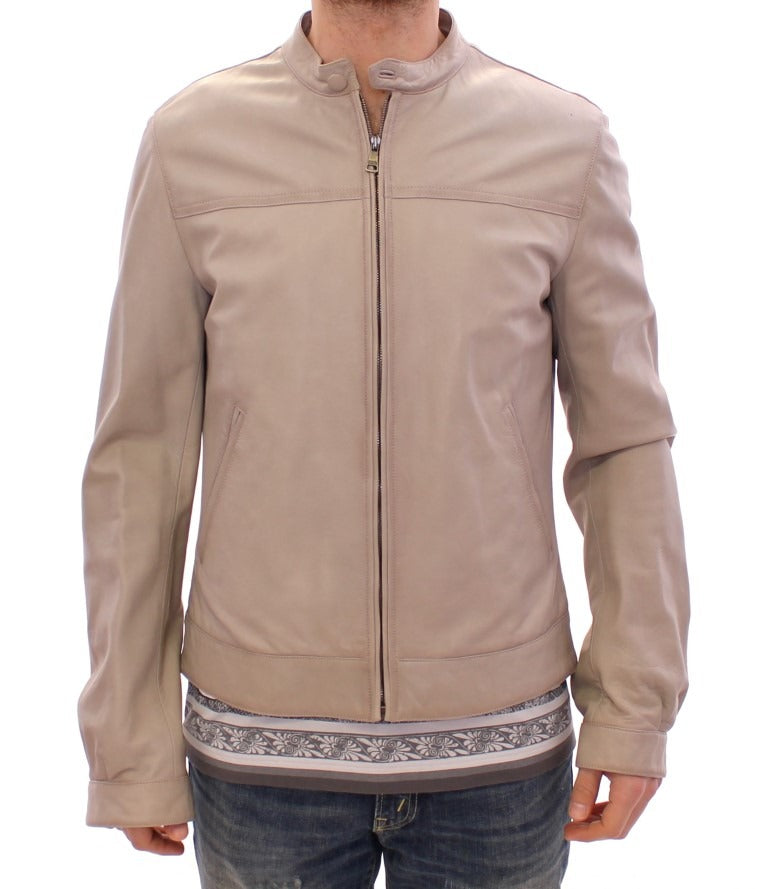 Beige leather biker jacket by Dolce & Gabbana, stylish and fitted with silver hardware, displayed on a hanger.