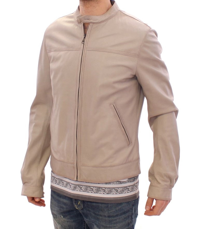Beige leather biker jacket from Dolce & Gabbana, featuring classic design with metal zipper and stylish collar.