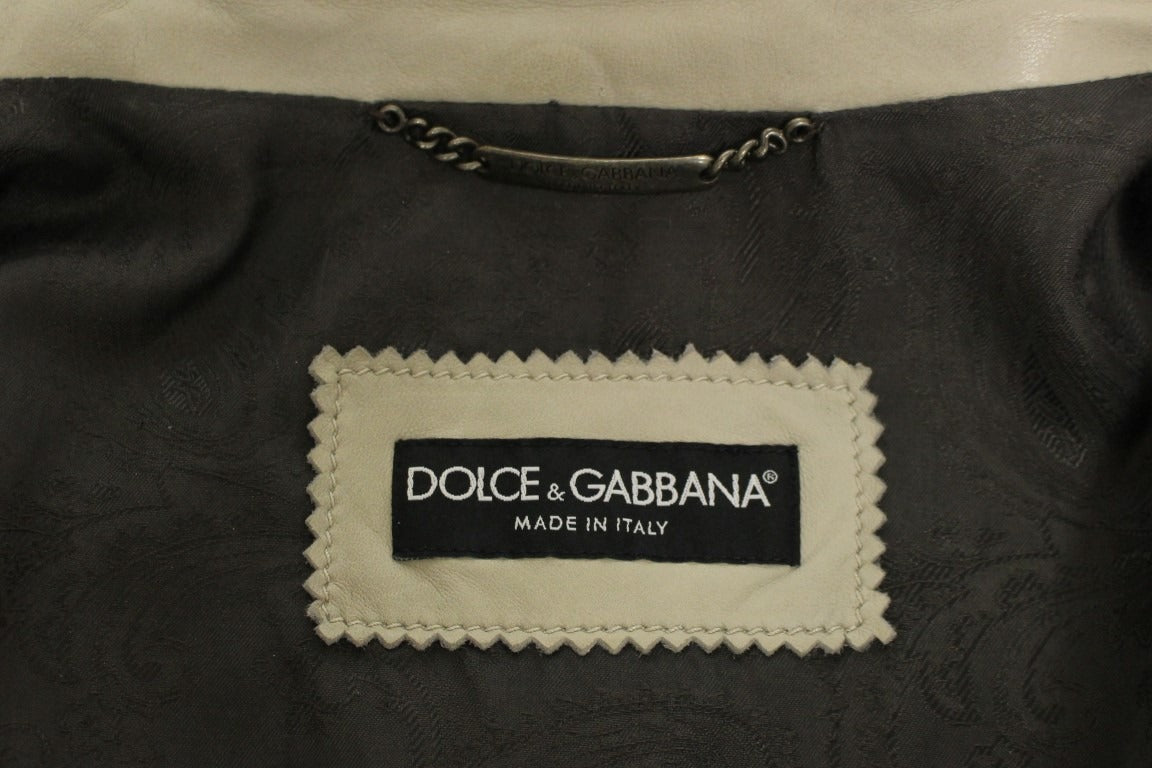 Beige leather biker jacket by Dolce & Gabbana, featuring classic design and detailed stitching, displayed on a hanger.