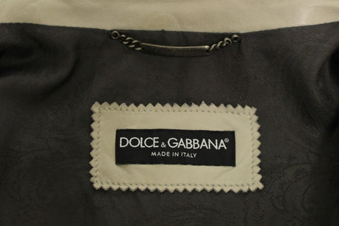 Beige leather biker jacket by Dolce & Gabbana, featuring classic design and detailed stitching, displayed on a hanger.