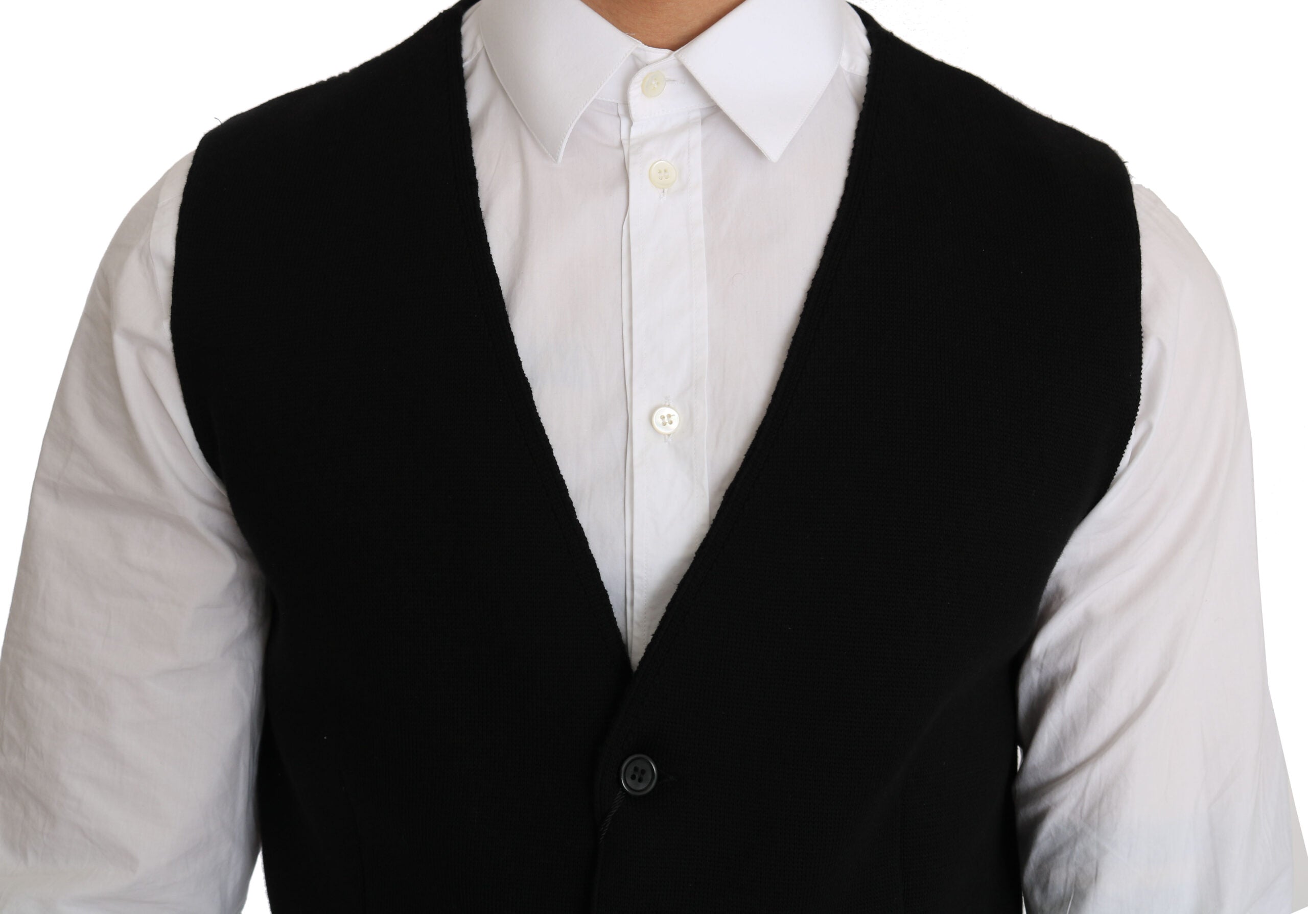 Black cotton dress with woven waistcoat by Dolce & Gabbana, showcasing a stylish layered look and detailed fabric texture.