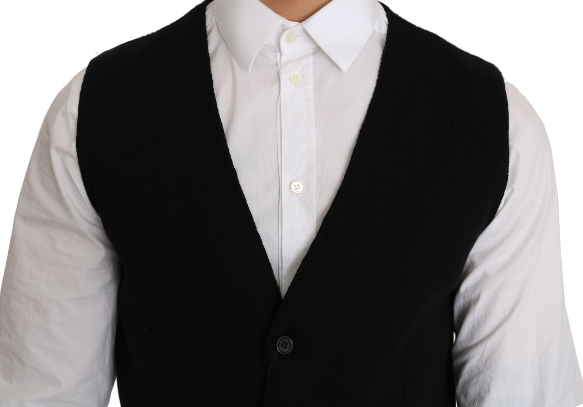 Black cotton dress with woven waistcoat by Dolce & Gabbana, showcasing a stylish layered look and detailed fabric texture.
