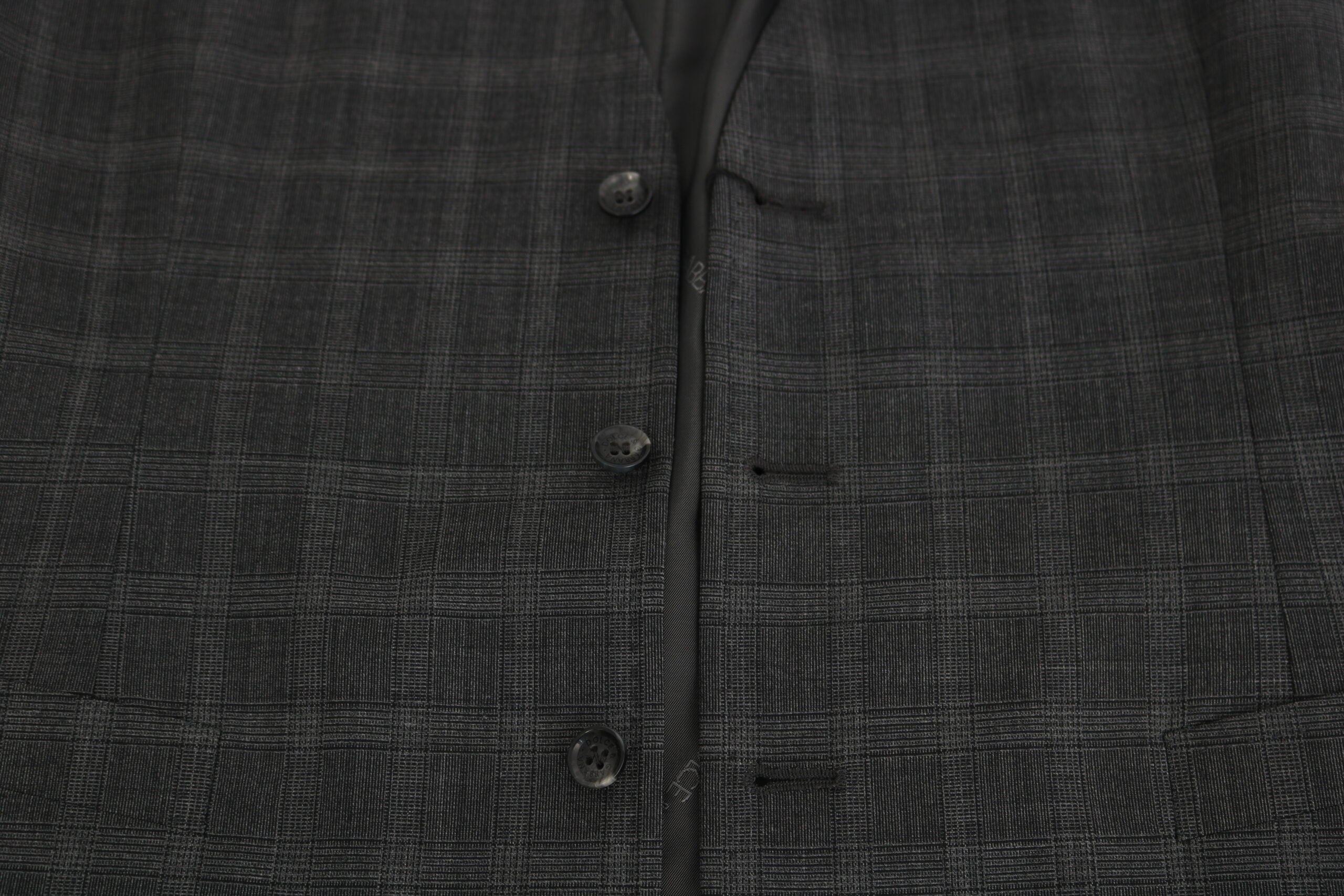 Gray wool checkered stretch vest by Dolce & Gabbana, tailored fit with a stylish pattern, shown on a mannequin.