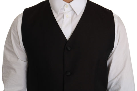 Black silk dress waistcoat by Dolce & Gabbana, tailored fit with sleek lapels and smooth fabric, styled on a mannequin.