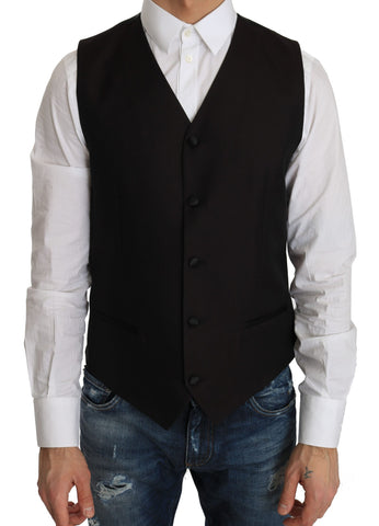 Black silk dress waistcoat by Dolce & Gabbana, tailored fit with sleek fabric and classic design, displayed on a hanger.