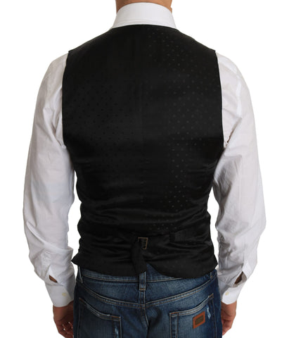 Black wool dress waistcoat by Dolce & Gabbana, tailored fit with button closure, displayed on a hanger.