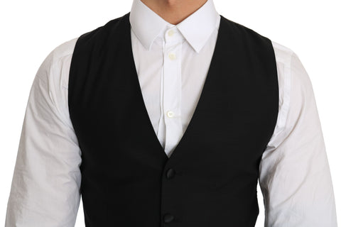 Black wool dress waistcoat by Dolce & Gabbana, tailored with a sleek fit and elegant design, shown on a mannequin.