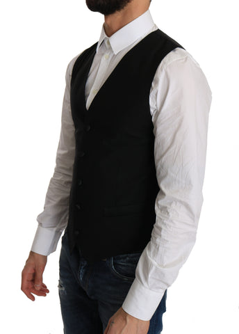Black wool dress waistcoat by Dolce & Gabbana, tailored fit with button closure and classic design, shown on a dress form.