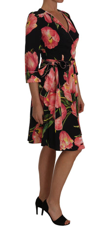 Black stretch shift dress with pink tulip print by Dolce & Gabbana, featuring a sleek, fitted silhouette and vibrant floral design.