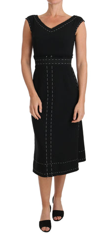 Black wool stretch A-line sheath dress by Dolce & Gabbana, shown on a mannequin with a fitted silhouette and elegant design.