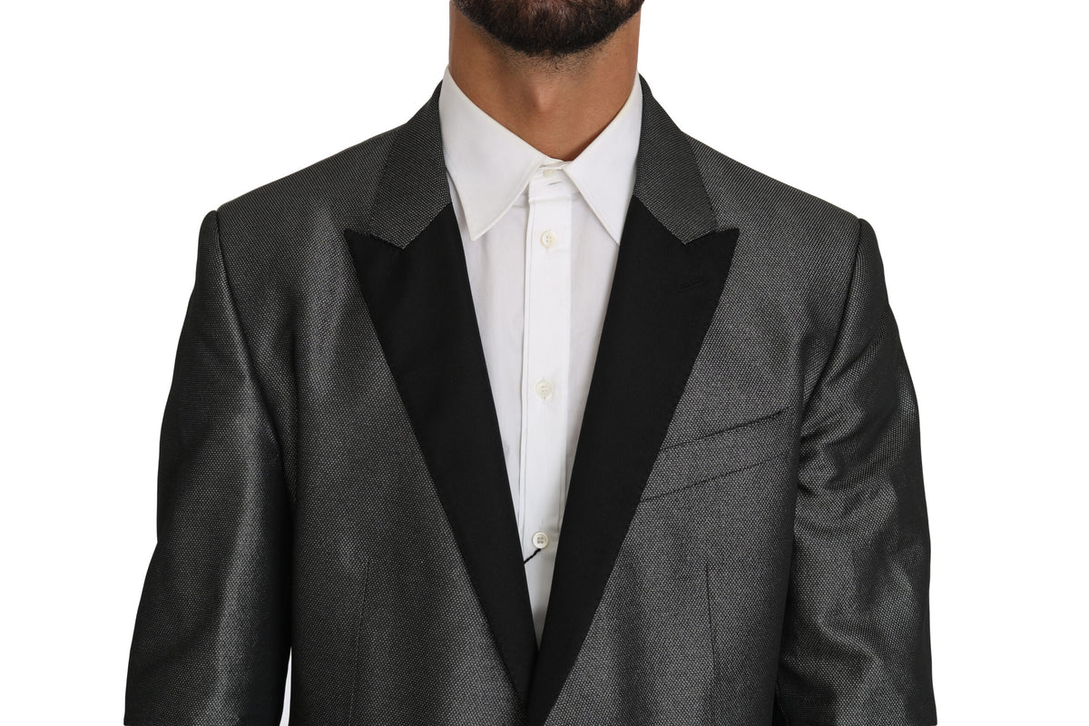 Gray patterned Martini 2-piece suit by Dolce & Gabbana, featuring tailored jacket and matching trousers on a hanger.