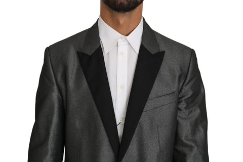 Gray patterned Martini 2-piece suit by Dolce & Gabbana, featuring tailored jacket and matching trousers on a hanger.