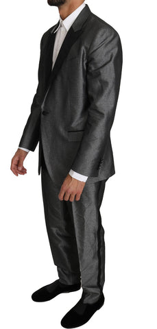 Gray patterned Martini 2-piece suit by Dolce & Gabbana, featuring tailored blazer and matching trousers on a mannequin.