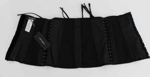 Black stretch corset waist strap belt from Dolce & Gabbana with adjustable fit and sleek design, showcased on a neutral background.