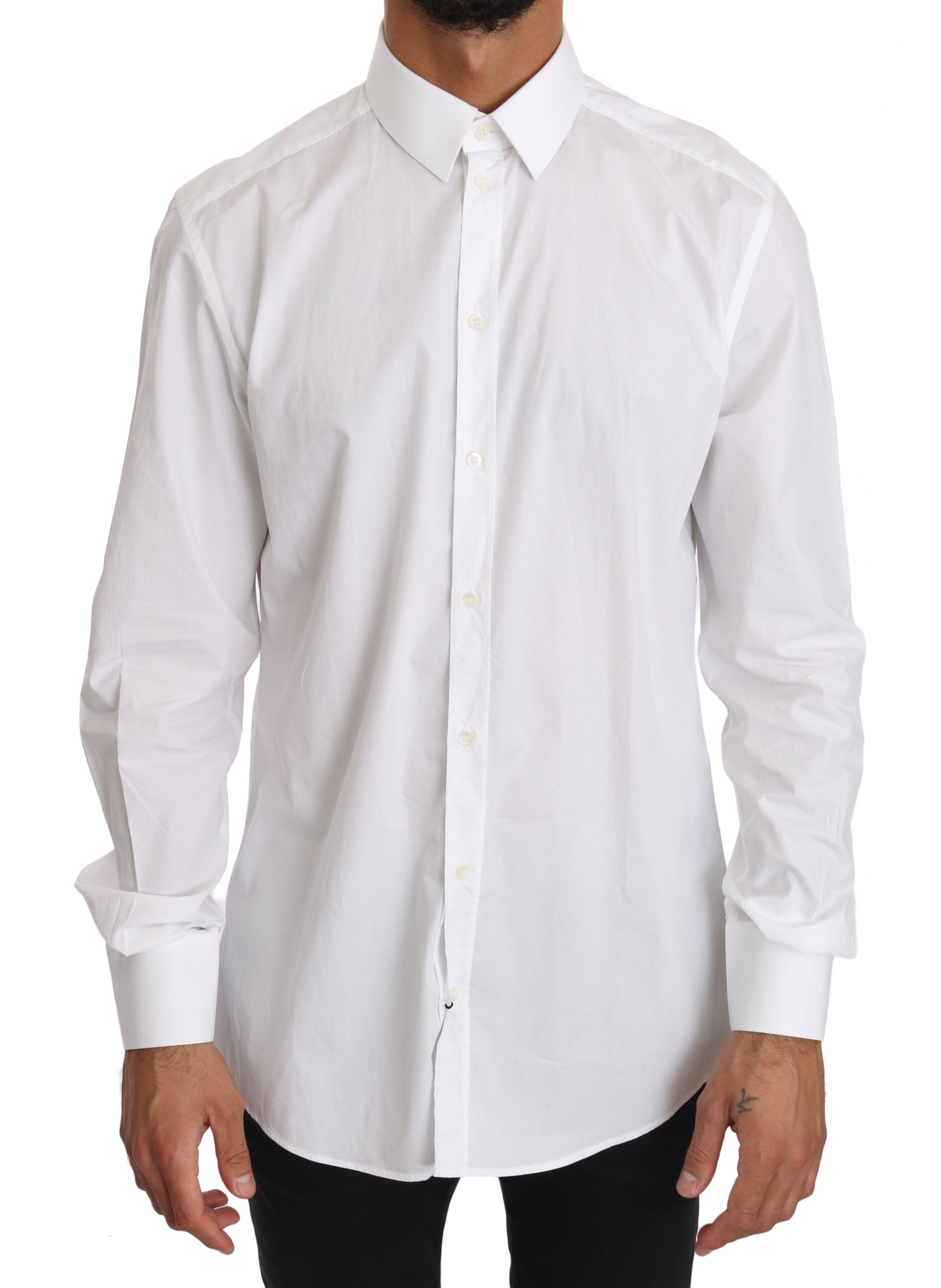 White cotton dress shirt by Dolce & Gabbana, featuring a classic fit and gold accents, displayed on a hanger.