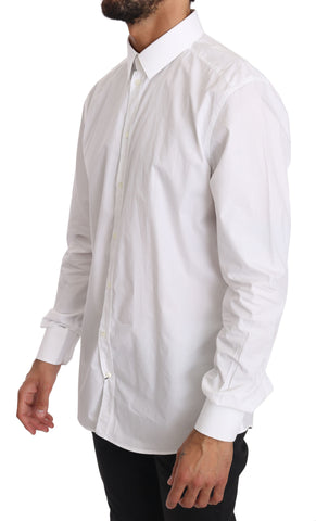 White cotton dress shirt by Dolce & Gabbana featuring a classic fit and gold accents, displayed on a hanger.