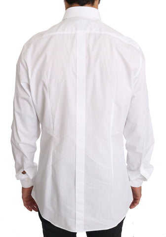 White cotton gold dress shirt by Dolce & Gabbana, featuring a classic fit with gold accents, shown on a hanger against a plain background.