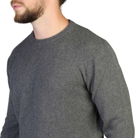 Gray 100% cashmere C-neck sweater by Jag Couture London New York, featuring soft fabric and classic fit, shown on a hanger.
