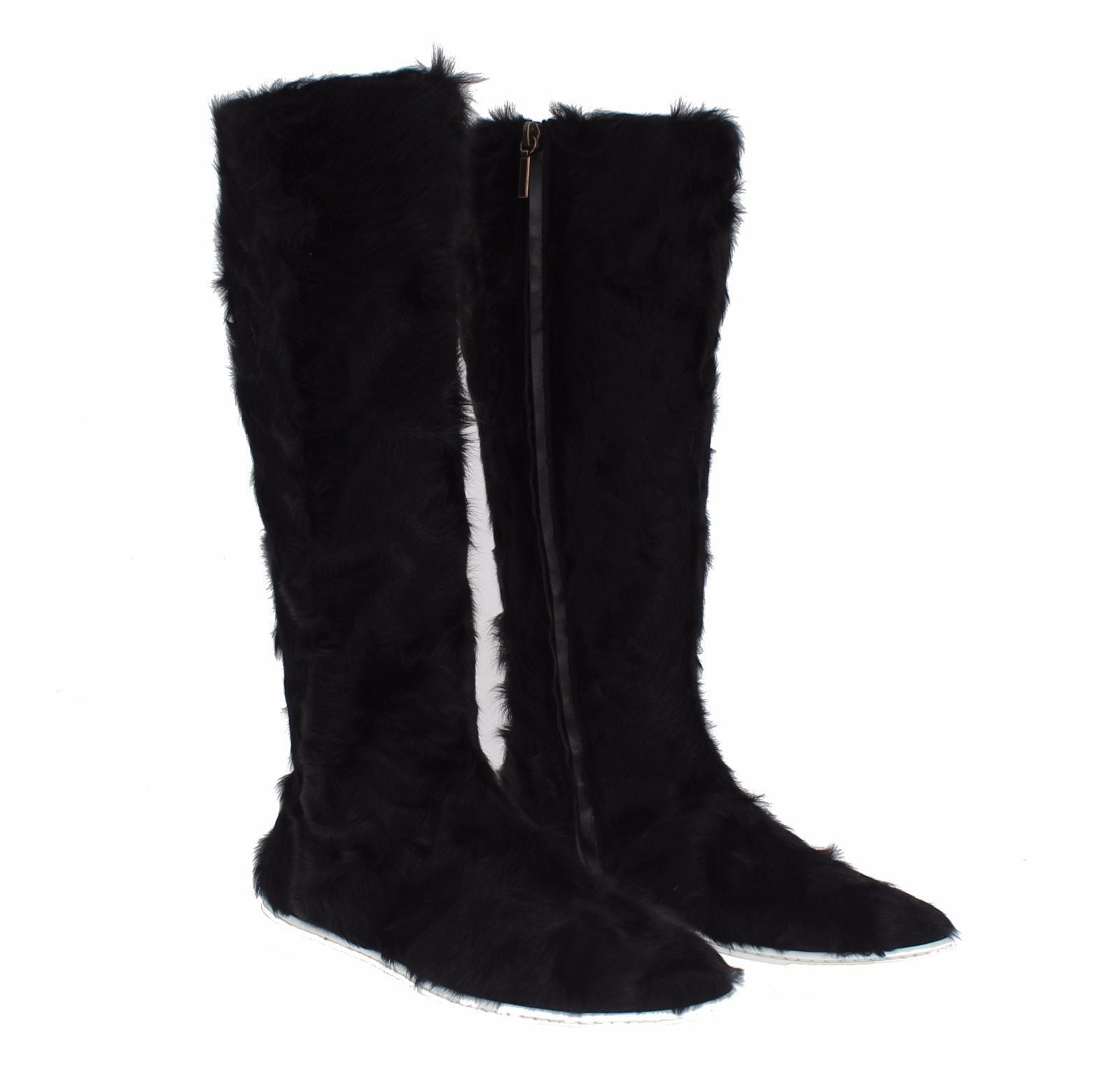 Black Xiangao lamb fur leather boots by Dolce & Gabbana, featuring sleek design and textured fur accents.