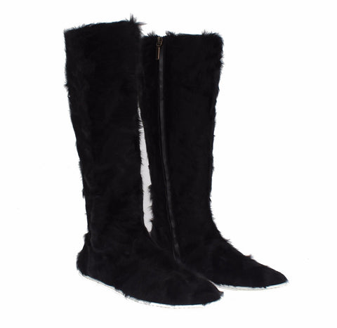Black Xiangao lamb fur leather boots by Dolce & Gabbana, featuring sleek design and textured fur accents.