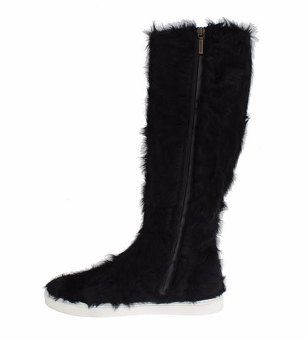 Black Xiangao lamb fur leather boots by Dolce & Gabbana, featuring sleek design and fur accents, displayed on a neutral background.