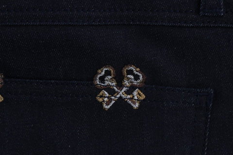 Blue Dolce & Gabbana Kate jeans with embroidered slim fit key design, showcasing detailed stitching and classic denim style.