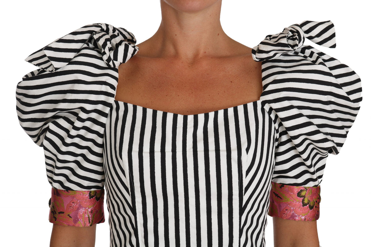 White and black striped cropped top with puff sleeves by Dolce & Gabbana, showcasing a stylish and trendy fashion piece.