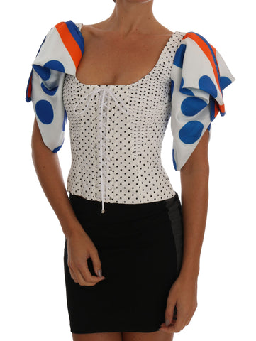 White polka silk corset bustier top by Dolce & Gabbana with fitted design and delicate polka dot pattern.
