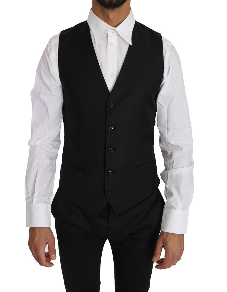 Black solid wool silk waistcoat vest by Dolce & Gabbana, tailored fit with sleek lapels and button closure.