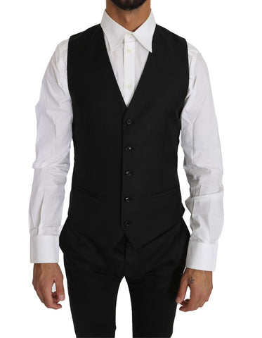 Black solid wool silk waistcoat vest by Dolce & Gabbana, tailored fit with sleek lapels and button closure.