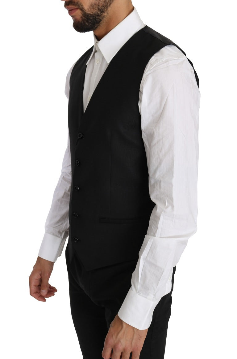 Black solid wool and silk waistcoat vest by Dolce & Gabbana, featuring tailored fit and classic style.