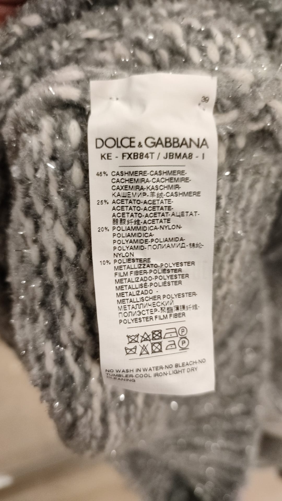 Gray cashmere turtle neck pullover sweater by Dolce & Gabbana, featuring a soft knit texture and classic fit.