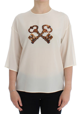 White sequined silk blouse by Dolce & Gabbana featuring a key design and T-shirt style with elegant sequined details.