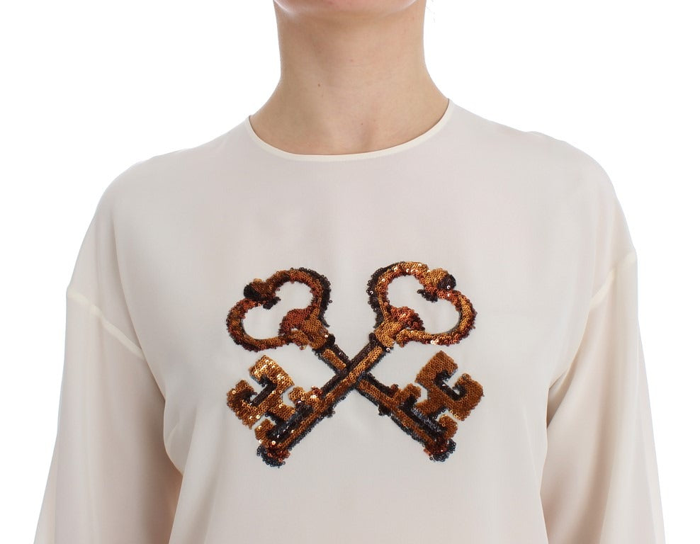 White sequined silk blouse T-shirt top by Dolce & Gabbana with shimmering sequins and a relaxed fit.