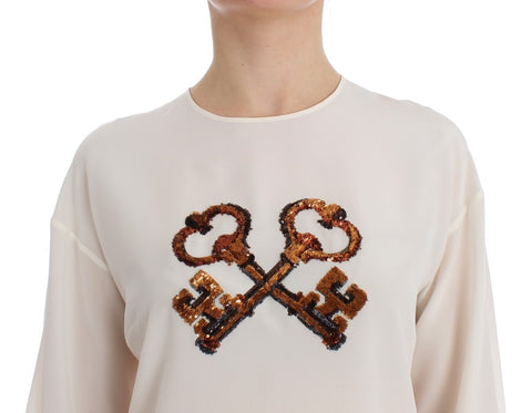White sequined silk blouse T-shirt top by Dolce & Gabbana with shimmering sequins and a relaxed fit.
