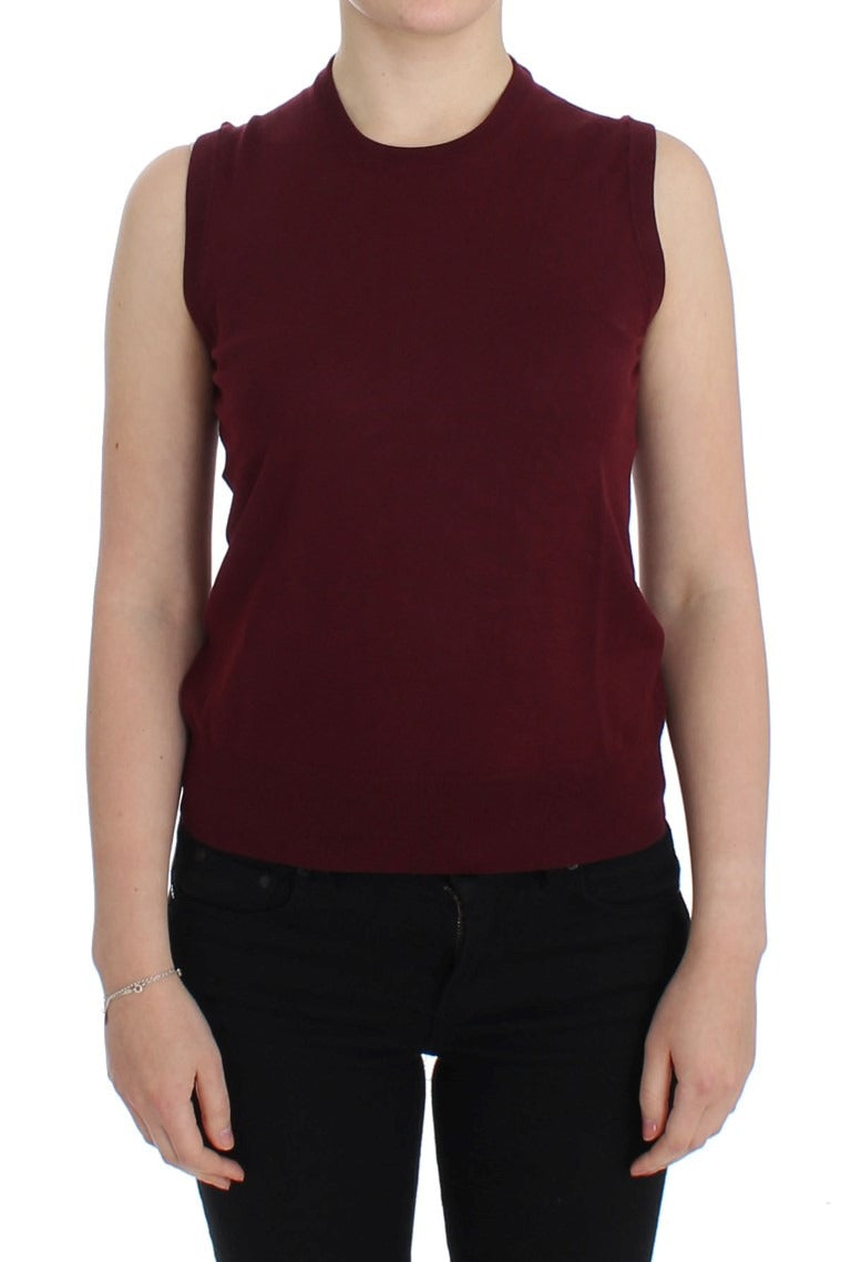 Red sleeveless crewneck vest pullover by Dolce & Gabbana, featuring a fitted design and smooth fabric.