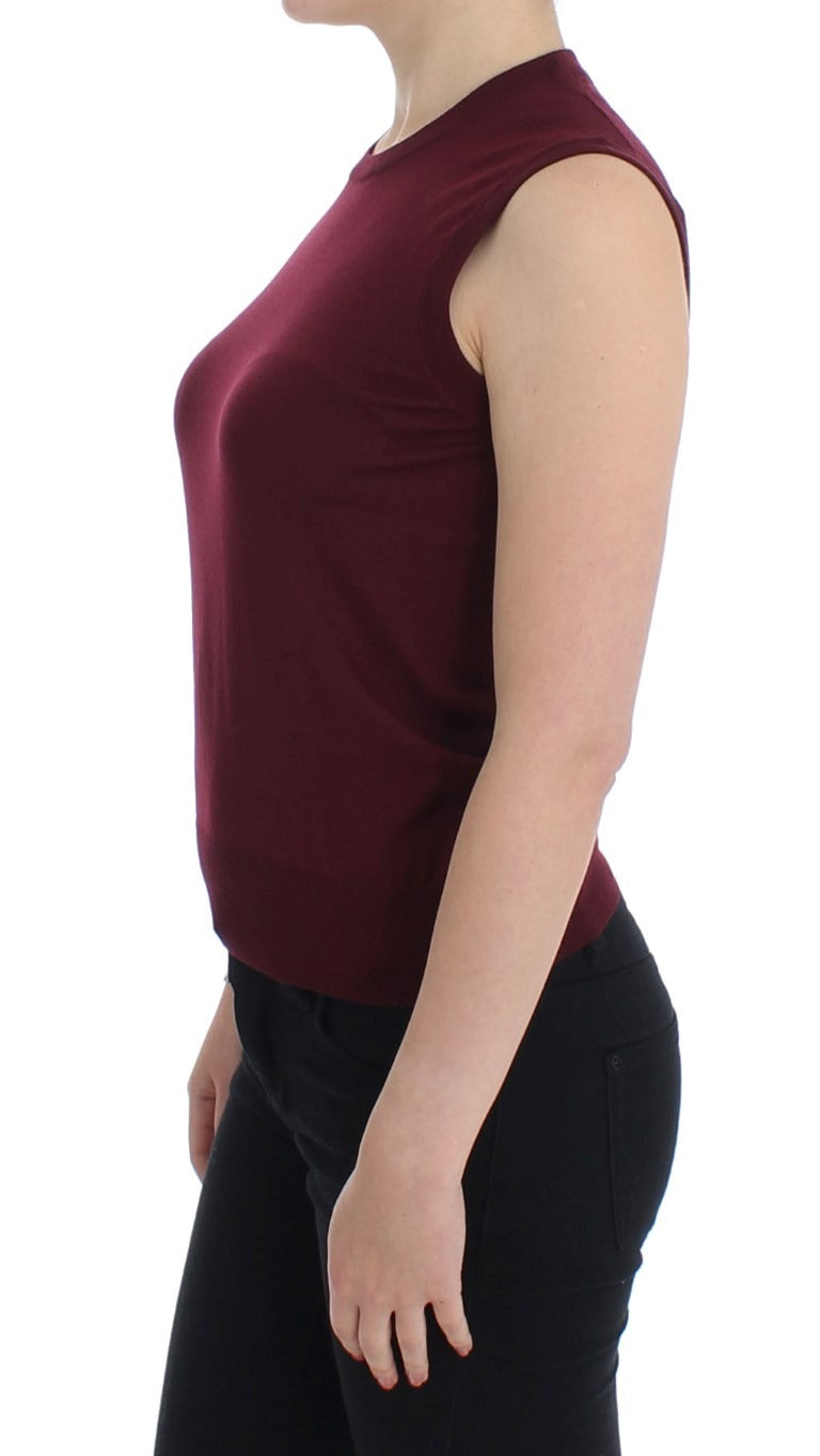 Red sleeveless crewneck vest pullover by Dolce & Gabbana, featuring a fitted design and ribbed texture.