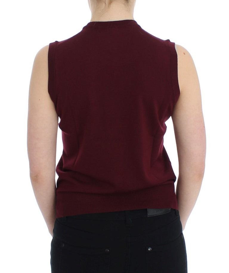 Red sleeveless crewneck vest pullover by Dolce & Gabbana, showing the front view with a fitted design and smooth fabric.