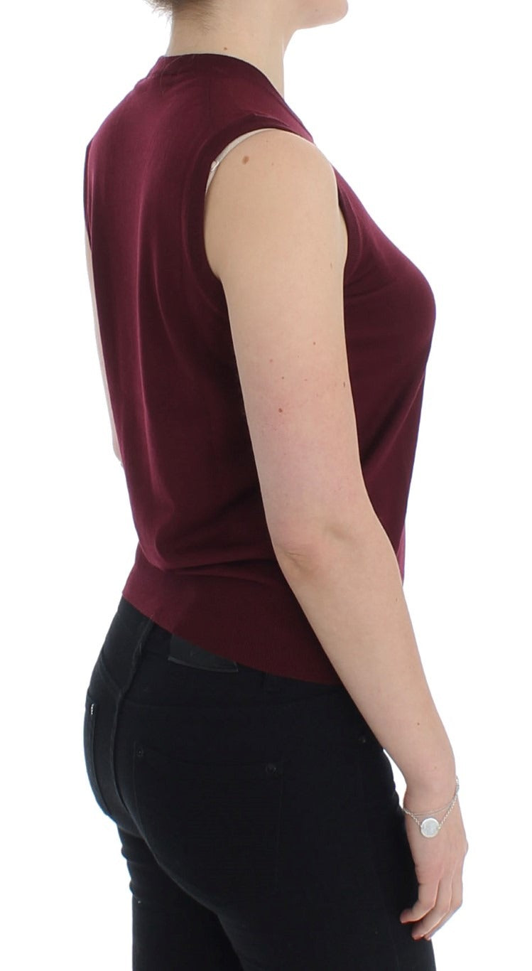 Red sleeveless crewneck vest pullover by Dolce & Gabbana, shown on a mannequin, highlighting the stylish sleeveless design and vibrant color.
