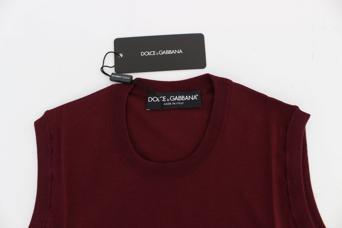 Red sleeveless crewneck vest pullover by Dolce & Gabbana, featuring a fitted sleeveless design and classic crewneck style.