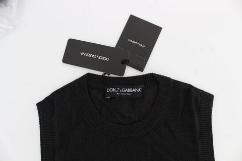 Black sleeveless crewneck vest pullover by Dolce & Gabbana, close-up of the stylish knit fabric and fitted design.