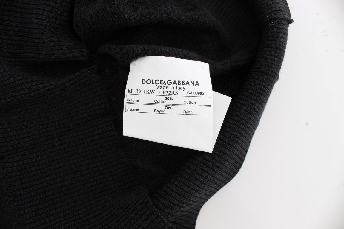 Black sleeveless crewneck vest pullover by Dolce & Gabbana, shown on a mannequin with a close-up view of the fabric and fit.