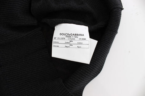Black sleeveless crewneck vest pullover by Dolce & Gabbana, shown on a mannequin with a close-up view of the fabric and fit.