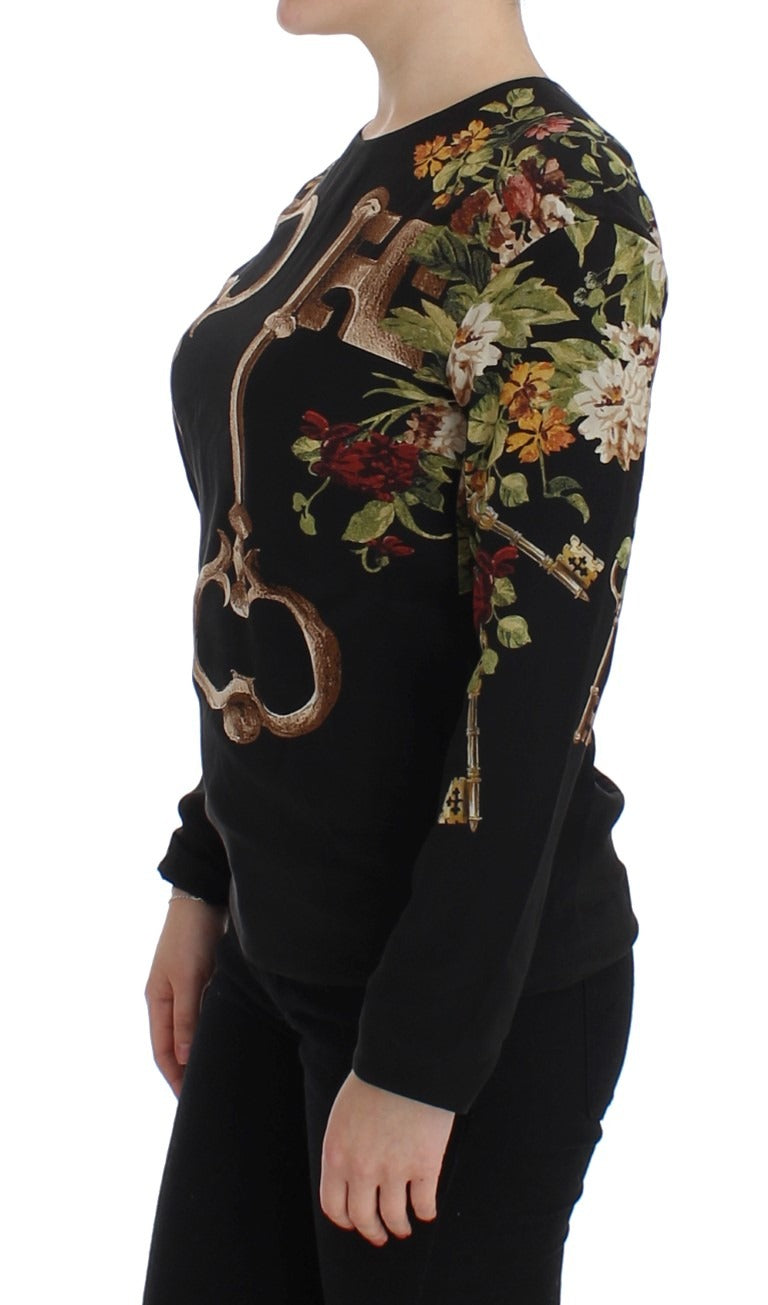 Black floral print silk blouse top by Dolce & Gabbana, featuring long sleeves and a stylish key pattern design.