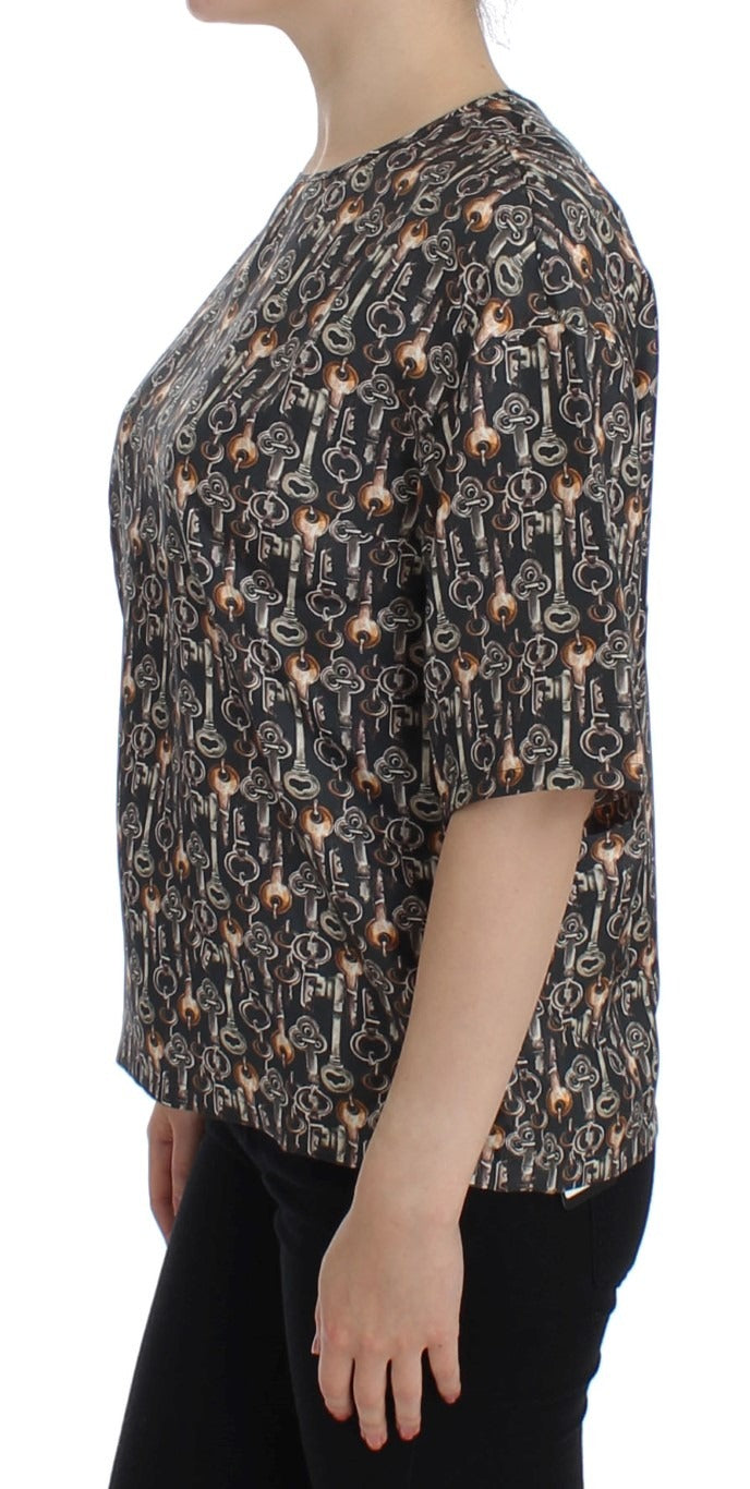 Gray silk blouse with gold key print by Dolce & Gabbana, featuring a stylish T-shirt design and elegant fabric.