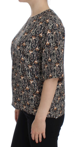 Gray silk blouse with gold key print by Dolce & Gabbana, featuring a stylish T-shirt design and elegant fabric.