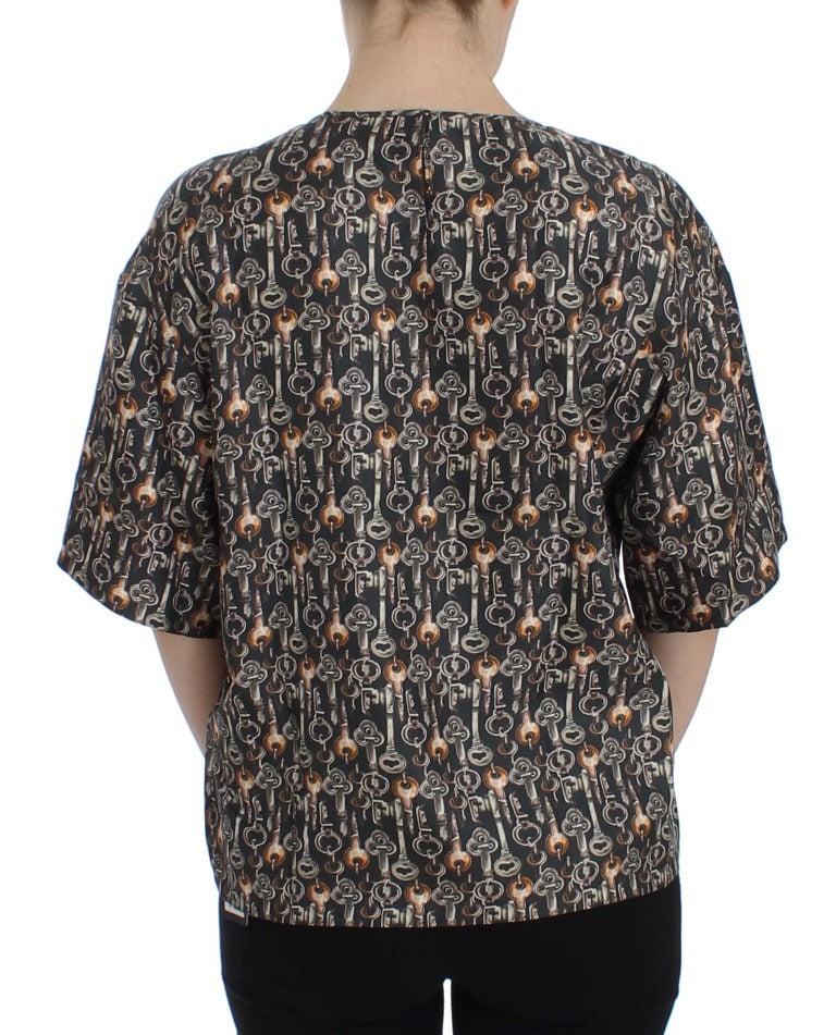 Gray silk blouse with gold key print, Dolce & Gabbana T-shirt featuring a stylish, luxurious design and elegant fabric.