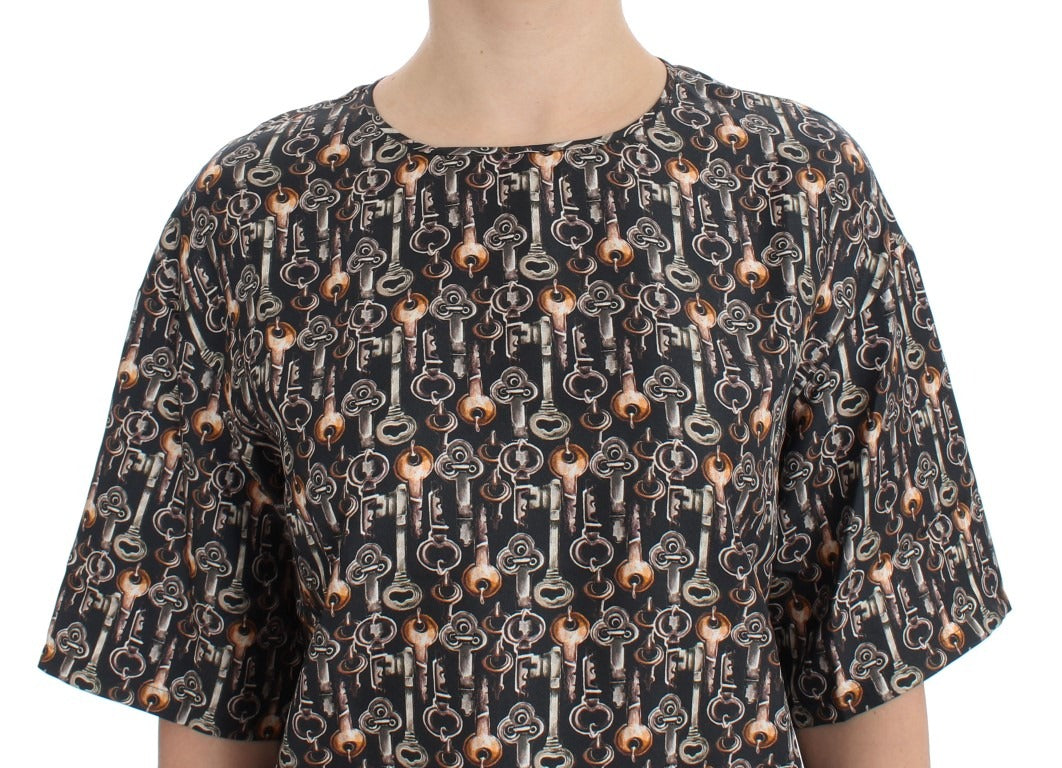 Gray silk blouse with gold key print from Dolce & Gabbana, featuring a T-shirt style with a relaxed fit.